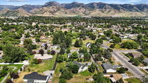 View of property location with a mountainous background and nearby suburban area
