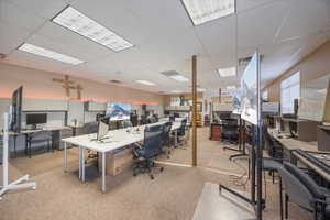 Office area with a paneled ceiling
