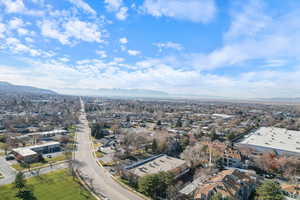 Aerial view of residential area featuring mountains