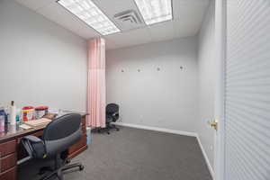 Home office with a drop ceiling