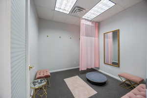 Misc room with a paneled ceiling