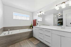 Ensuite bathroom with double vanity and a garden tub