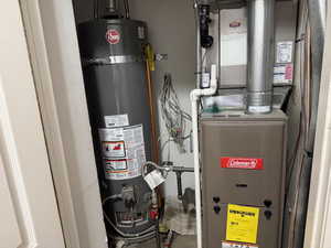 Utilities featuring strapped water heater and heating unit