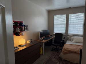 Office featuring a textured ceiling