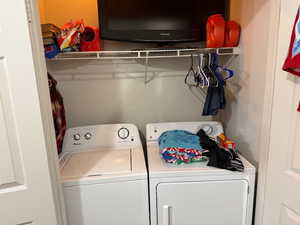 Laundry room featuring washer and clothes dryer