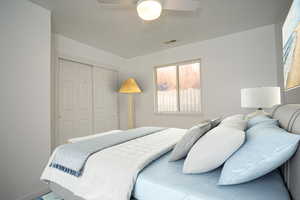 Bedroom featuring a closet and a ceiling fan