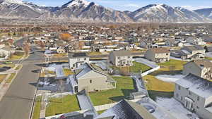 Aerial perspective of suburban area with a mountainous background