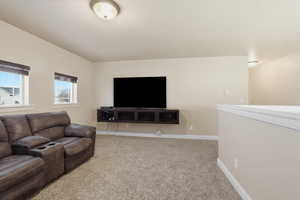 Living room with carpet and baseboards