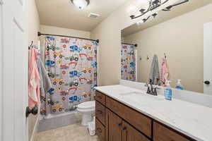 Full bath with vanity and toilet