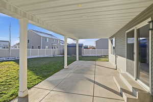 Fenced backyard featuring a patio area