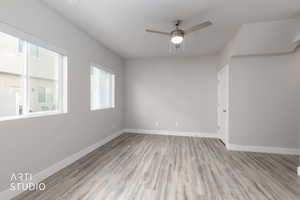 Unfurnished room featuring light wood-style floors and a ceiling fan