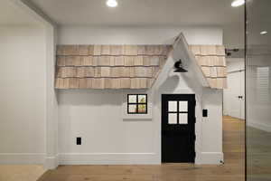 Foyer entrance featuring a textured ceiling, hardwood / wood-style flooring, and recessed lighting