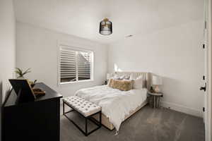 Bedroom with carpet and baseboards