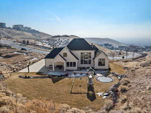Rear view of house featuring a patio and a mountain view