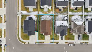 Aerial perspective of suburban area featuring property parcel outlined