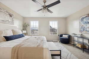 Bedroom with carpet and ceiling fan