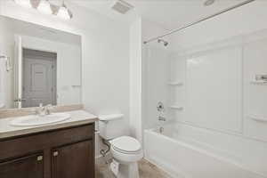 Bathroom with vanity and shower / washtub combination