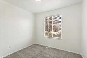 Spare room with carpet flooring and baseboards