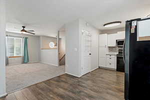 Kitchen featuring stainless steel appliances, white cabinets, healthy amount of natural light, and tasteful backsplash