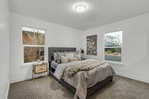 Carpeted bedroom with baseboards