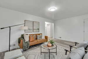 Living area featuring wood finished floors and baseboards