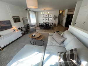 Living room with a decorative wall and wood finished floors