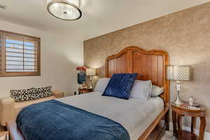 Bedroom featuring an accent wall