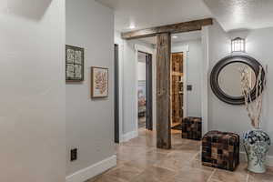 Hallway with a textured ceiling