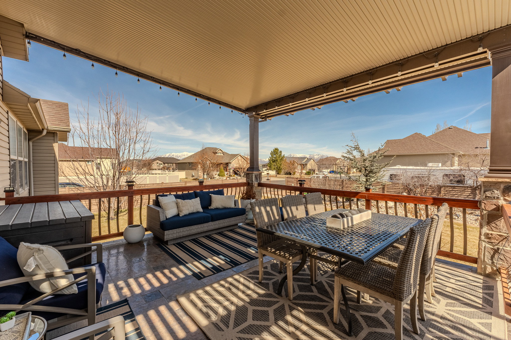 Wooden deck with a residential view and an outdoor living space