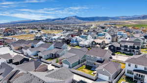 Aerial view of residential area featuring mountains