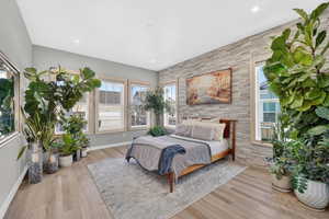 Owner's Suite with tons of natural light and beautiful upgraded accent stone wall