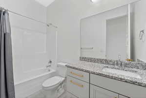 Full bath with shower / tub combo and vanity next to upstairs bedrooms