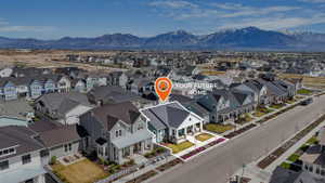 Aerial perspective of suburban area featuring a mountain backdrop