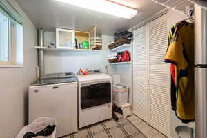 Washroom featuring separate washer and dryer