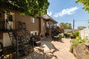 Patio / terrace with stairs, a patio area, and outdoor dining area