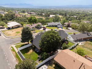 Aerial view of residential area featuring a mountainous background