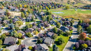 Aerial overview of property's location with nearby suburban area