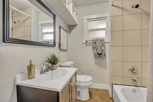 Bathroom with vanity and shower / tub combo