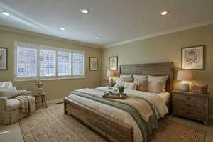 Carpeted bedroom featuring ornamental molding, a textured ceiling, and recessed lighting