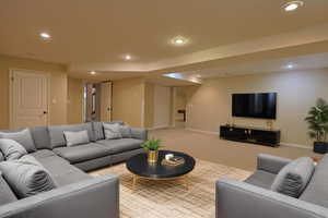 Living area featuring carpet and recessed lighting