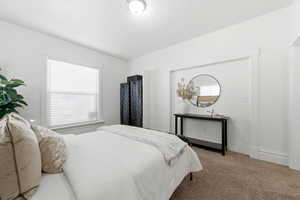 Carpeted bedroom with baseboards