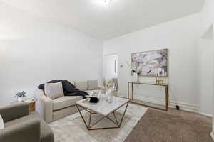 Living area with carpet floors and baseboards