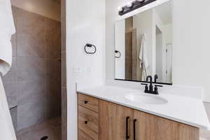 Full bathroom featuring vanity and a walk in shower
