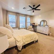 Bedroom with multiple windows, carpet, a ceiling fan, and recessed lighting