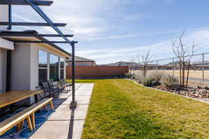 Fenced backyard featuring a patio area and outdoor dining space