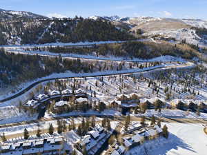 Snowy aerial view with a mountain view