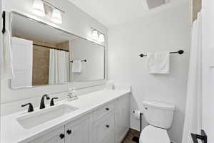 Bathroom featuring vanity and a shower with curtain