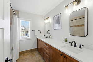 Full bath featuring double vanity