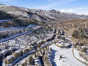 Snowy aerial view featuring a mountain view