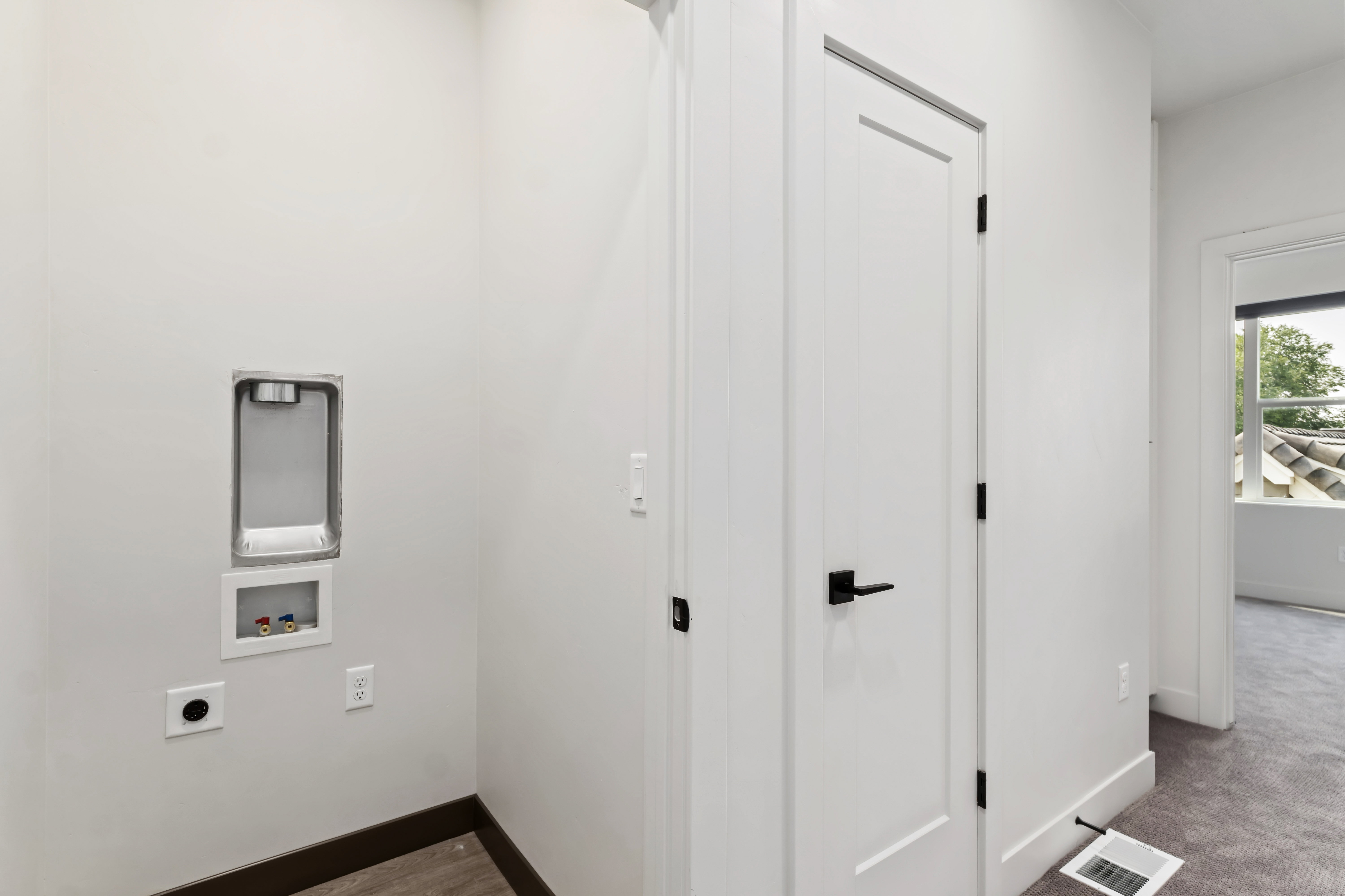 Washroom featuring electric dryer hookup and hookup for a washing machine